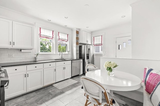 115 Westbourne Ter Unit 1, Brookline, MA 02446 - kitchen with appliances with stainless steel finishes, plenty of natural light, white cabinets, and recessed lighting