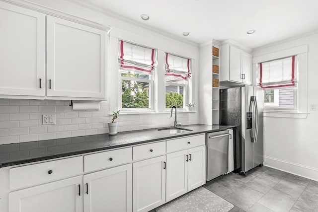 115 Westbourne Ter Unit 1, Brookline, MA 02446 - kitchen with stainless steel appliances, dark countertops, backsplash, white cabinets, and recessed lighting