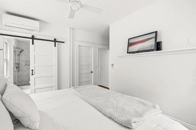 115 Westbourne Ter Unit 1, Brookline, MA 02446 - bedroom with a wall mounted air conditioner, a barn door, and a ceiling fan