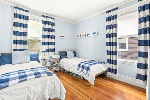 115 Westbourne Ter Unit 1, Brookline, MA 02446 - bedroom with crown molding and wood finished floors