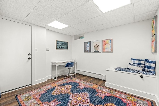 115 Westbourne Ter Unit 1, Brookline, MA 02446 - home office featuring a baseboard heating unit, wood finished floors, and a drop ceiling