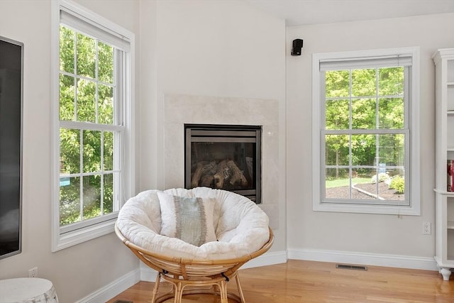 35 Beverly Hill Dr, Shrewsbury, MA 01545 - sitting room featuring wood finished floors, baseboards, a premium fireplace, and healthy amount of natural light