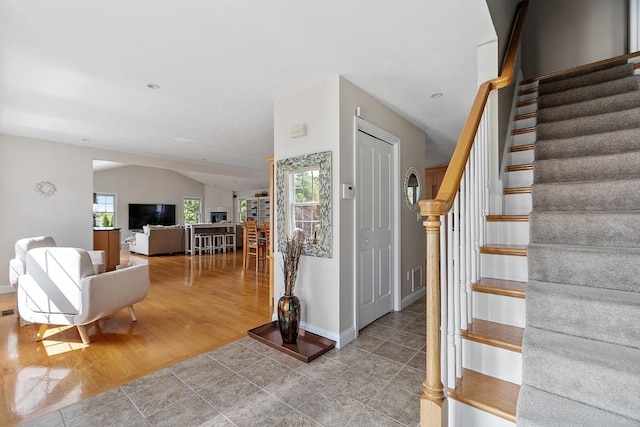 35 Beverly Hill Dr, Shrewsbury, MA 01545 - staircase featuring tile patterned flooring, vaulted ceiling, and baseboards