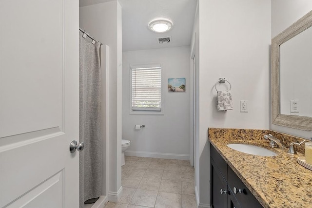 35 Beverly Hill Dr, Shrewsbury, MA 01545 - full bath with baseboards, vanity, toilet, and tile patterned floors