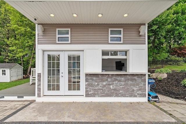 35 Beverly Hill Dr, Shrewsbury, MA 01545 - view of patio / terrace with french doors, fence, an outdoor structure, a storage unit, and a deck