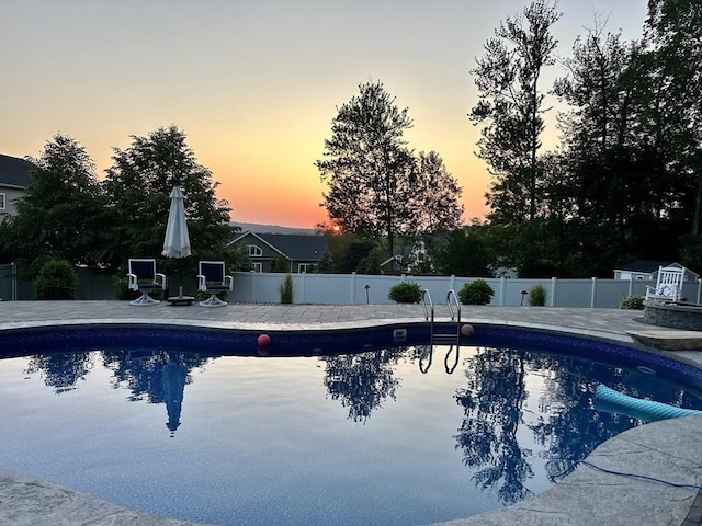35 Beverly Hill Dr, Shrewsbury, MA 01545 - pool at dusk featuring fence and a patio