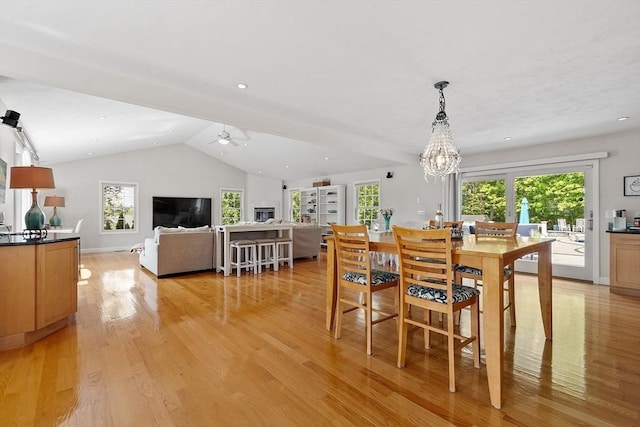 35 Beverly Hill Dr, Shrewsbury, MA 01545 - dining space with a chandelier, vaulted ceiling, light wood finished floors, and a ceiling fan