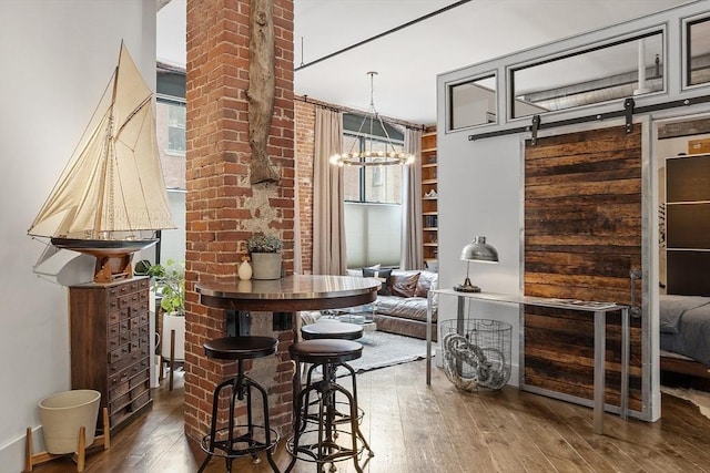172-178 Green St Unit 1, Boston, MA 02130 - dining space with hardwood / wood-style flooring and a chandelier