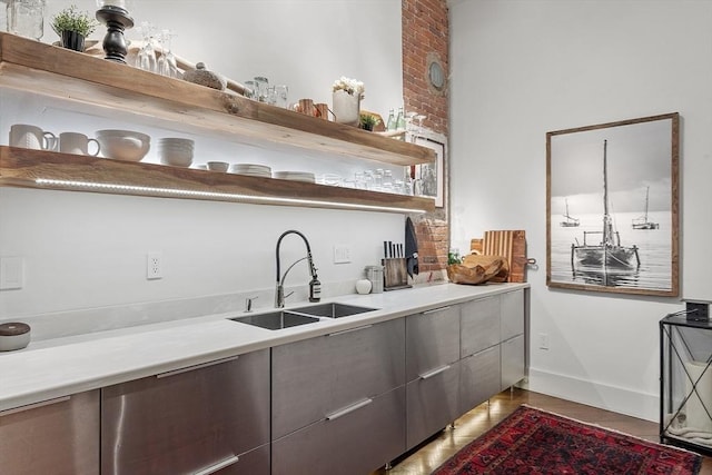 172-178 Green St Unit 1, Boston, MA 02130 - bar area featuring a sink, light wood finished floors, and baseboards