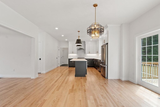 LOT16 Rawson Farm, Mendon, MA 01756 - kitchen with light countertops, an inviting chandelier, plenty of natural light, high end refrigerator, and a kitchen island