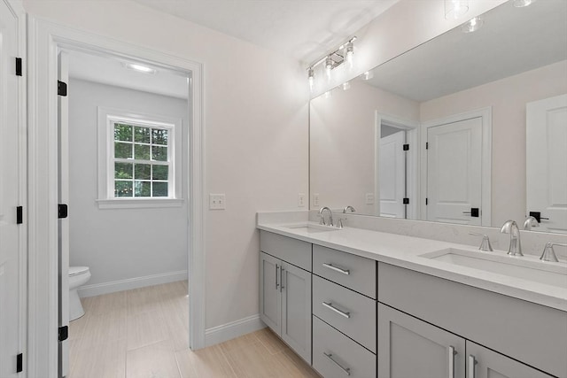 LOT16 Rawson Farm, Mendon, MA 01756 - full bathroom with double vanity, toilet, baseboards, and a sink