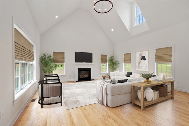 living room featuring light hardwood / wood-style flooring and high vaulted ceiling