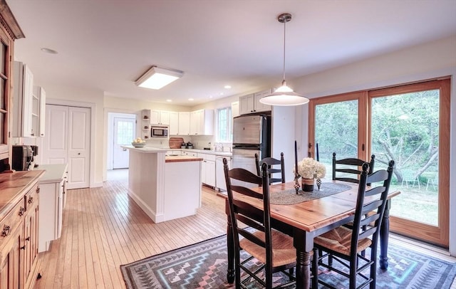 250 S Eastham St, Eastham, MA 02642 - dining area with light wood-style floors and baseboards