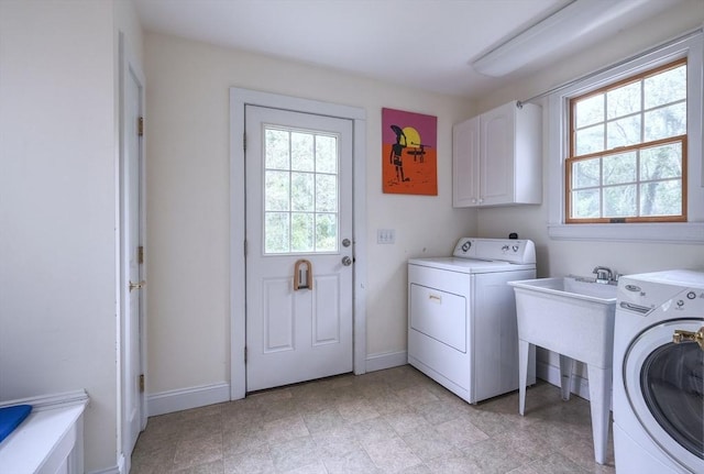 250 S Eastham St, Eastham, MA 02642 - washroom with washer / dryer, cabinet space, and plenty of natural light