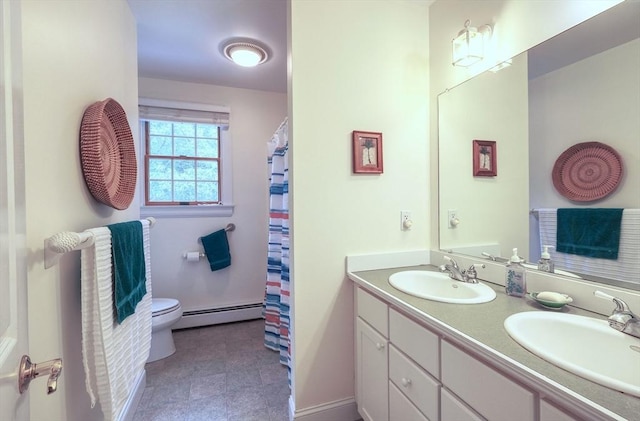 250 S Eastham St, Eastham, MA 02642 - bathroom with a baseboard radiator, toilet, and double vanity