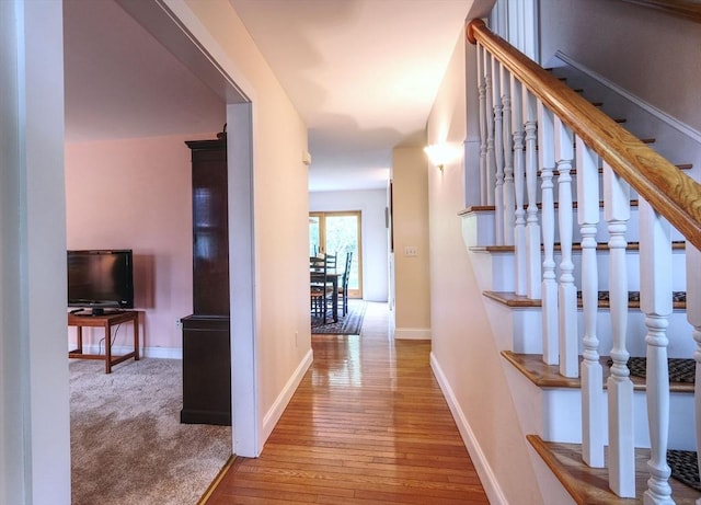 250 S Eastham St, Eastham, MA 02642 - hallway with hardwood / wood-style flooring, stairs, and baseboards