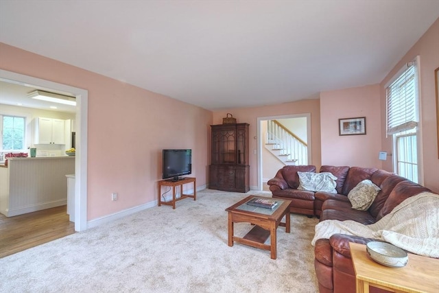 250 S Eastham St, Eastham, MA 02642 - living area featuring carpet flooring, stairway, and baseboards