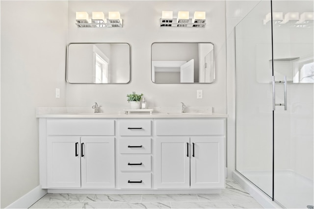 bathroom with a shower with door and vanity