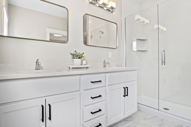 bathroom featuring vanity and an enclosed shower