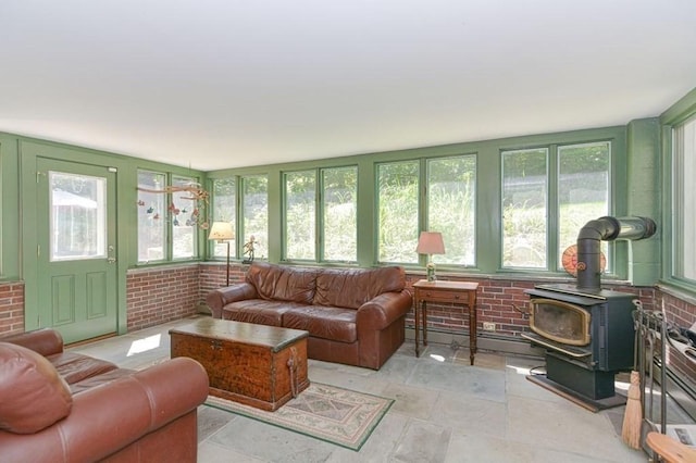 sunroom with a wood stove