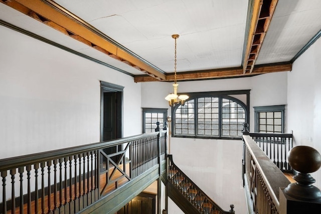 corridor with an inviting chandelier and a wealth of natural light