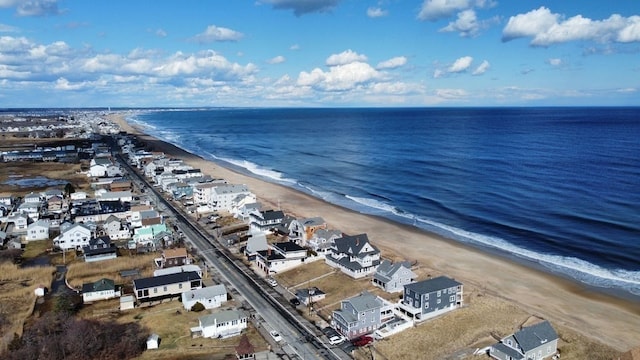 bird's eye view with a water view and a view of the beach