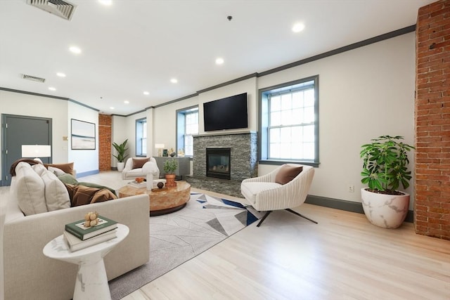 515 Centre St Unit 2, Newton, MA 02458 - living room with crown molding, light wood finished floors, plenty of natural light, baseboards, and recessed lighting