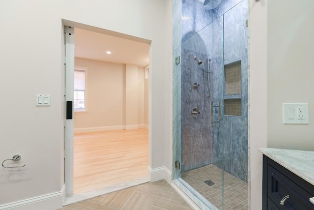 515 Centre St Unit 2, Newton, MA 02458 - full bathroom featuring a stall shower, baseboards, vanity, and parquet floors