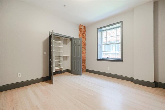 515 Centre St Unit 2, Newton, MA 02458 - unfurnished bedroom featuring light wood-style floors and baseboards