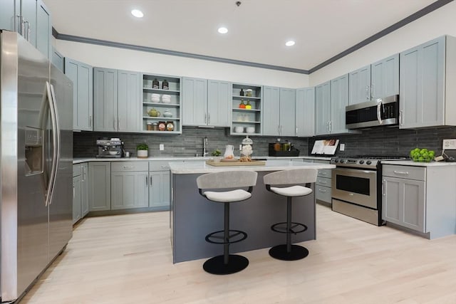 515 Centre St Unit 2, Newton, MA 02458 - kitchen with appliances with stainless steel finishes, open shelves, ornamental molding, backsplash, and a sink