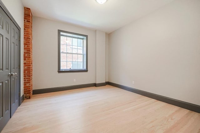 515 Centre St Unit 2, Newton, MA 02458 - unfurnished bedroom featuring light wood finished floors, a closet, and baseboards