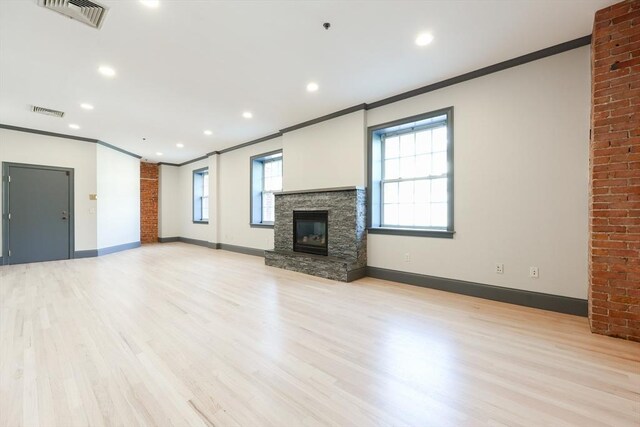 515 Centre St Unit 2, Newton, MA 02458 - unfurnished living room with crown molding, a fireplace, baseboards, light wood-style flooring, and recessed lighting