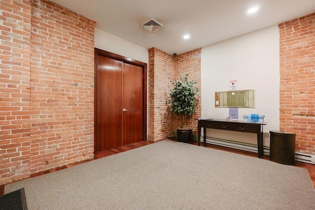515 Centre St Unit 2, Newton, MA 02458 - hallway featuring brick wall, wood finished floors, recessed lighting, and a baseboard heating unit