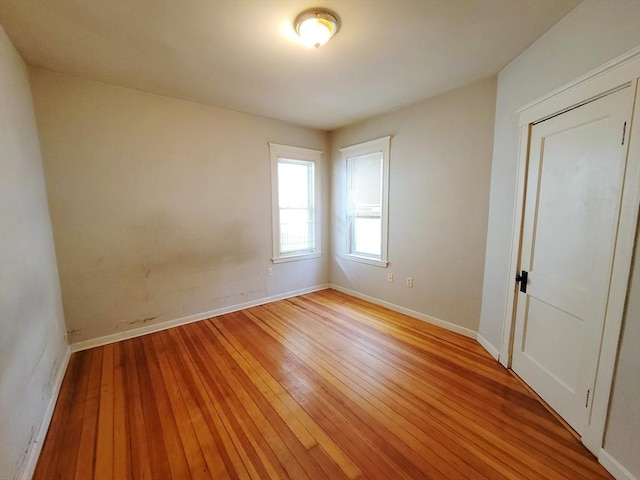 spare room with light wood-type flooring