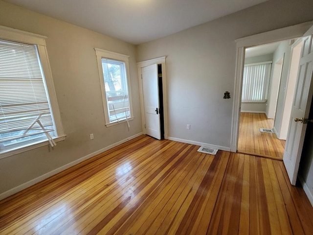 unfurnished bedroom featuring light wood-type flooring