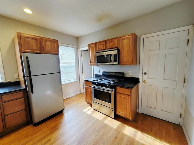 kitchen featuring appliances with stainless steel finishes and light wood-type flooring