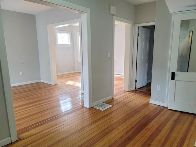 spare room with light wood-type flooring