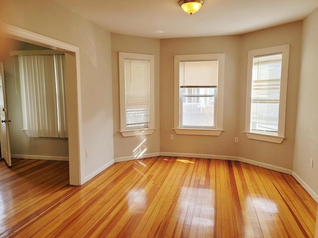 spare room featuring light hardwood / wood-style floors