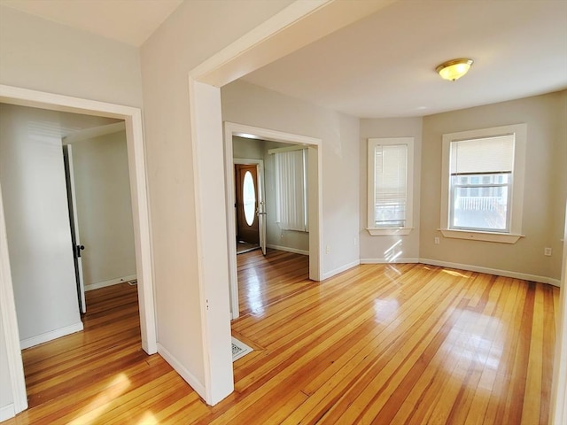 unfurnished room with light hardwood / wood-style floors