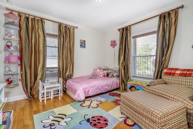 bedroom featuring wood finished floors