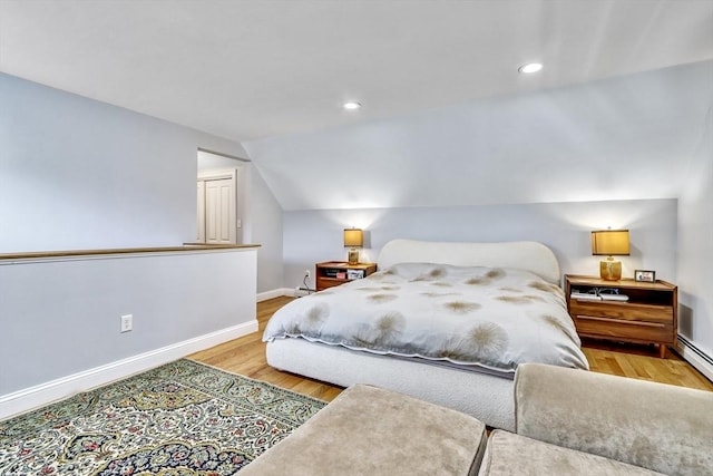 bedroom featuring baseboards, wood finished floors, lofted ceiling, and recessed lighting