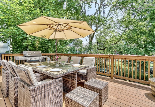 deck with outdoor dining area and grilling area
