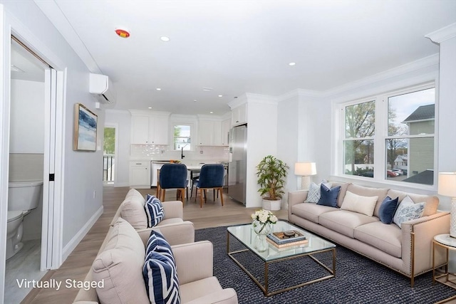 161 Sumner St Unit 1, Quincy, MA 02169 - living room featuring light wood-style flooring, recessed lighting, and crown molding