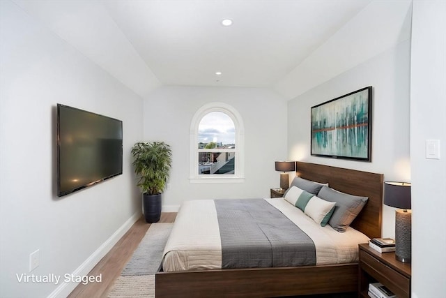 161 Sumner St Unit 1, Quincy, MA 02169 - bedroom with wood finished floors, lofted ceiling, baseboards, and recessed lighting