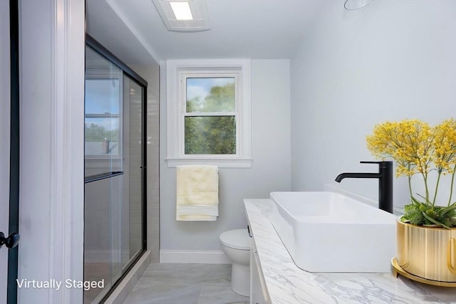 161 Sumner St Unit 1, Quincy, MA 02169 - full bath with a sink, a shower stall, toilet, baseboards, and marble look tile flooring
