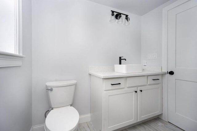 161 Sumner St Unit 1, Quincy, MA 02169 - half bath with toilet, vanity, and baseboards