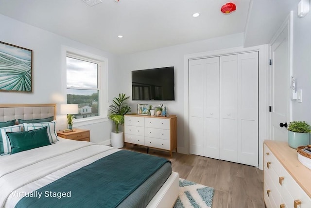 161 Sumner St Unit 1, Quincy, MA 02169 - bedroom with light wood finished floors, a closet, and recessed lighting