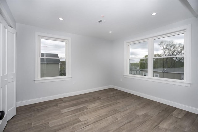 161 Sumner St Unit 1, Quincy, MA 02169 - unfurnished room featuring plenty of natural light, wood finished floors, baseboards, and recessed lighting