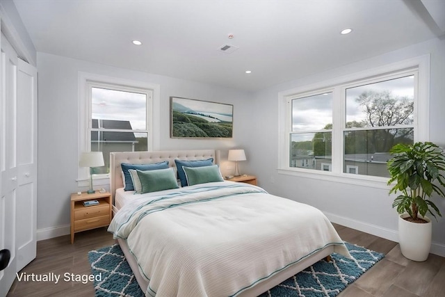 161 Sumner St Unit 1, Quincy, MA 02169 - bedroom featuring baseboards, recessed lighting, and wood finished floors