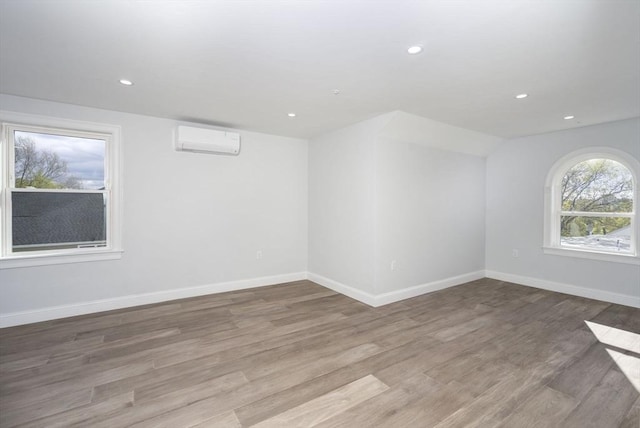 161 Sumner St Unit 1, Quincy, MA 02169 - additional living space featuring a wall mounted AC, wood finished floors, recessed lighting, and baseboards